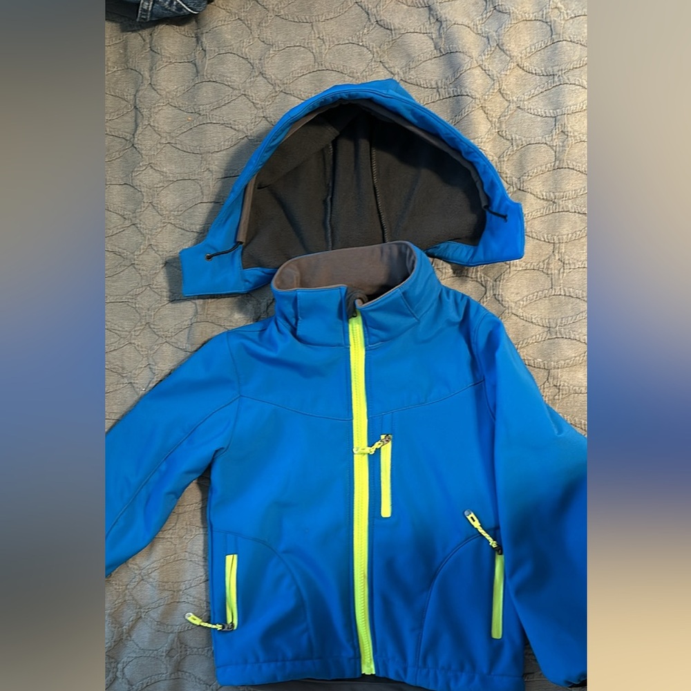 Water resistant, wind resistant, breathable and reflective jacket.